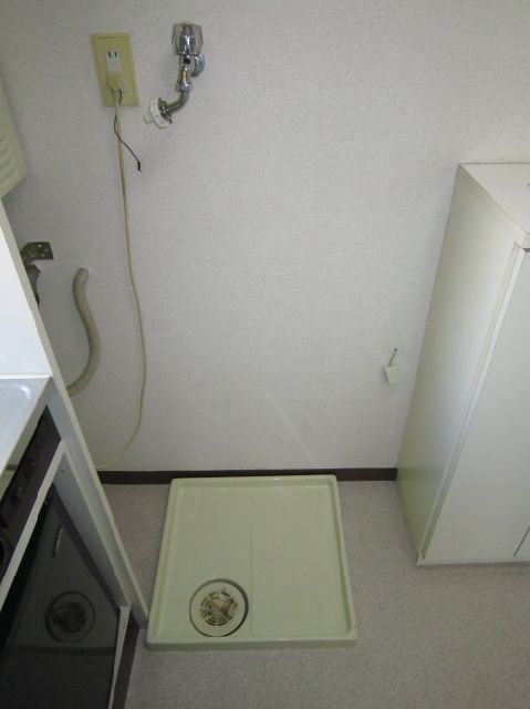 Other room space. Washing machine in the room