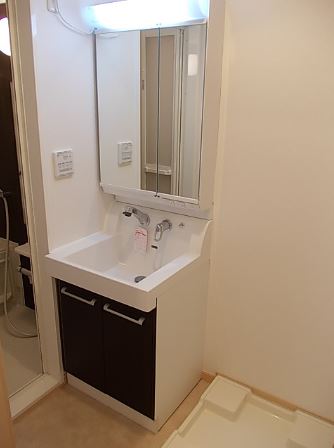 Washroom. Independent wash basin with convenient shampoo dresser in a busy morning