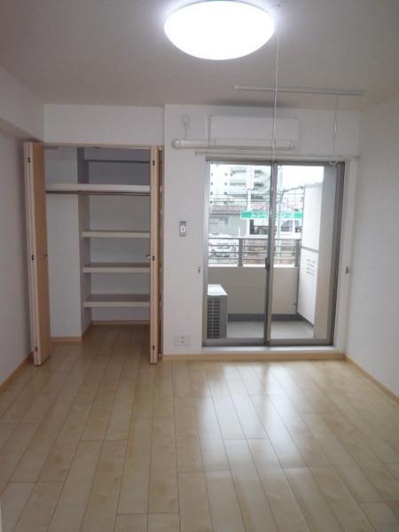 Living and room. It is a bright room with daylight