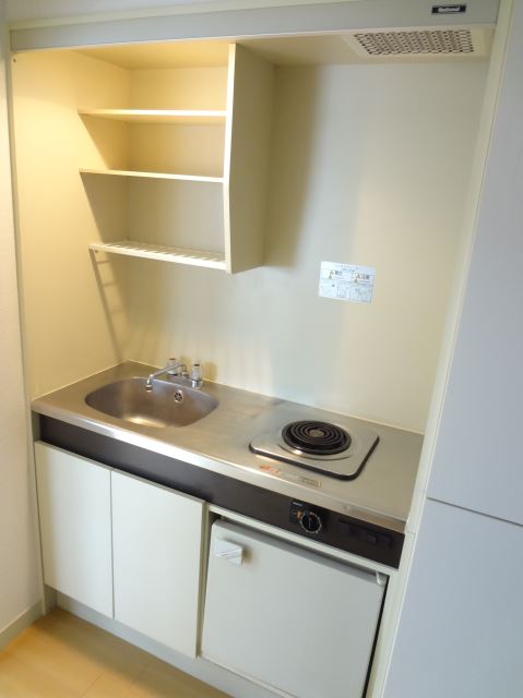 Kitchen. It is a kitchen with electric stove. 