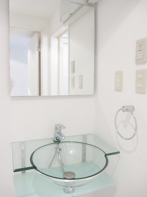 Washroom. Transparent stylish wash basin