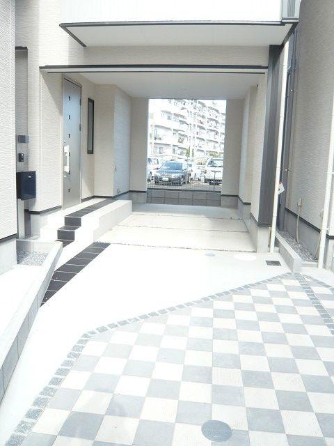 Parking lot. Approach to neatly interlocked parking. Parking is widely, You can easily loading and unloading your car.