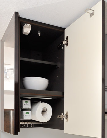 Kitchen.  [Cupboard hanging with earthquake-resistant latch] Convenient hanging cupboard with a paper holder and wrap holder. Also equipped with storage hanger.