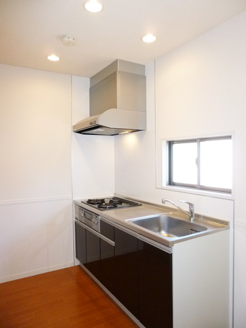 Kitchen. 3-burner stove is a good ventilated pat usability there is a ventilation window