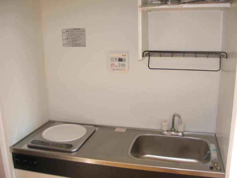 Kitchen. The photograph is in a different Room No..