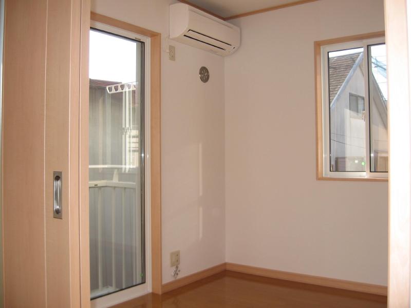 Living and room. The photograph is in a different Room No..