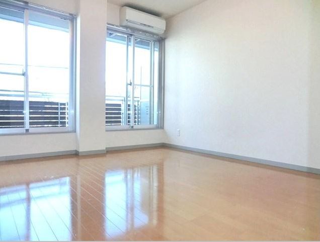 Living and room. Is a large room with windows