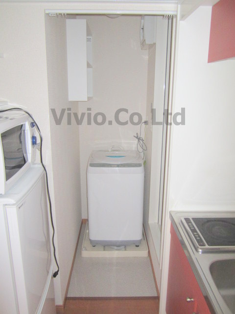 Other room space. Fully automatic washing machine is in the room. 