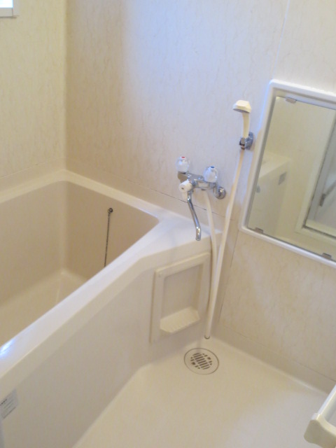 Bath. There is a window in the bathroom