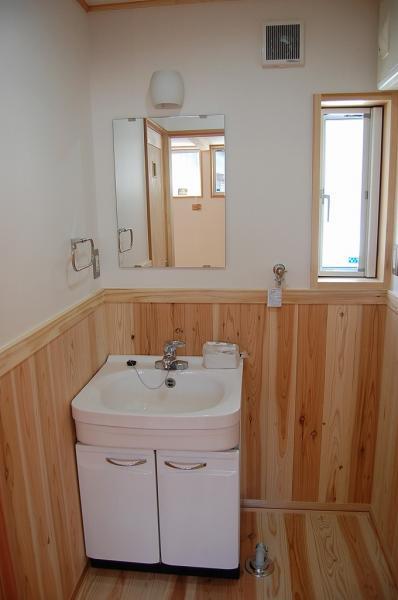 Wash basin, toilet. Vanity with happy shower feature in a busy morning