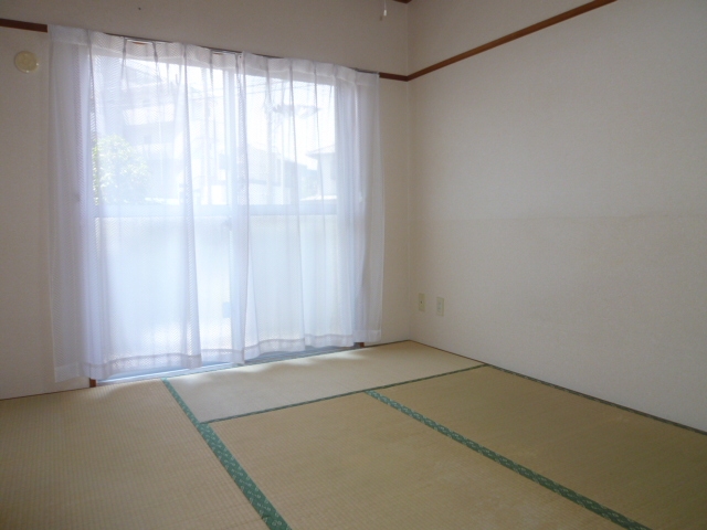 Other room space. It is a photograph of the same type of room