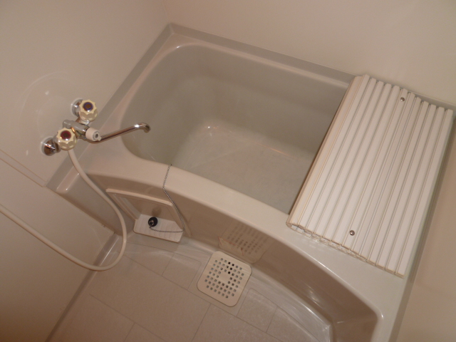 Bath. It is a photograph of the same type of room