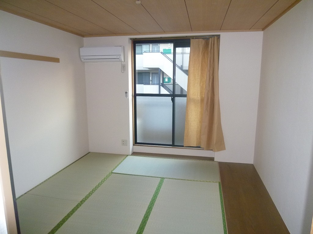 Other room space. It is a photograph of another room of the same properties