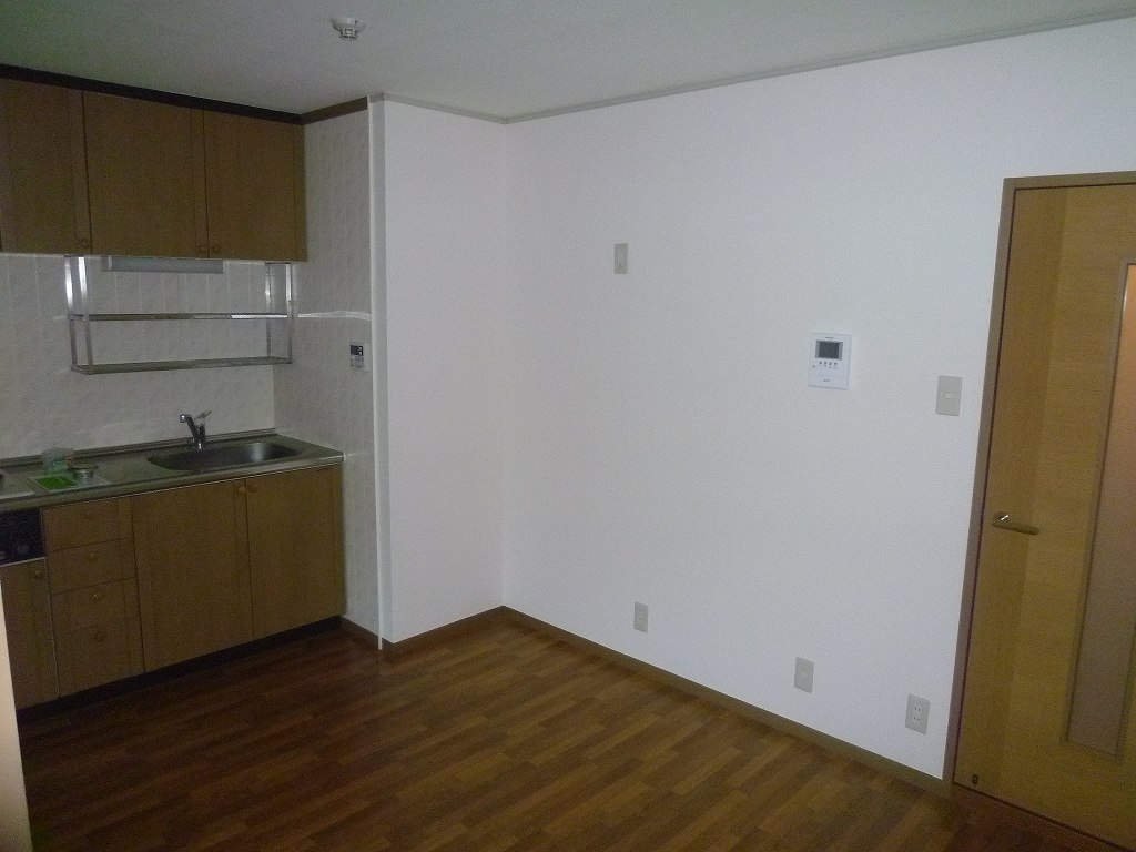 Living and room. It is a photograph of another room of the same properties