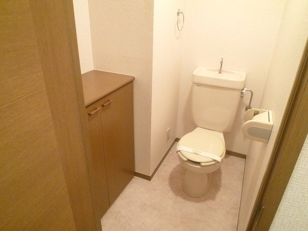 Toilet. It is a photograph of another room of the same properties