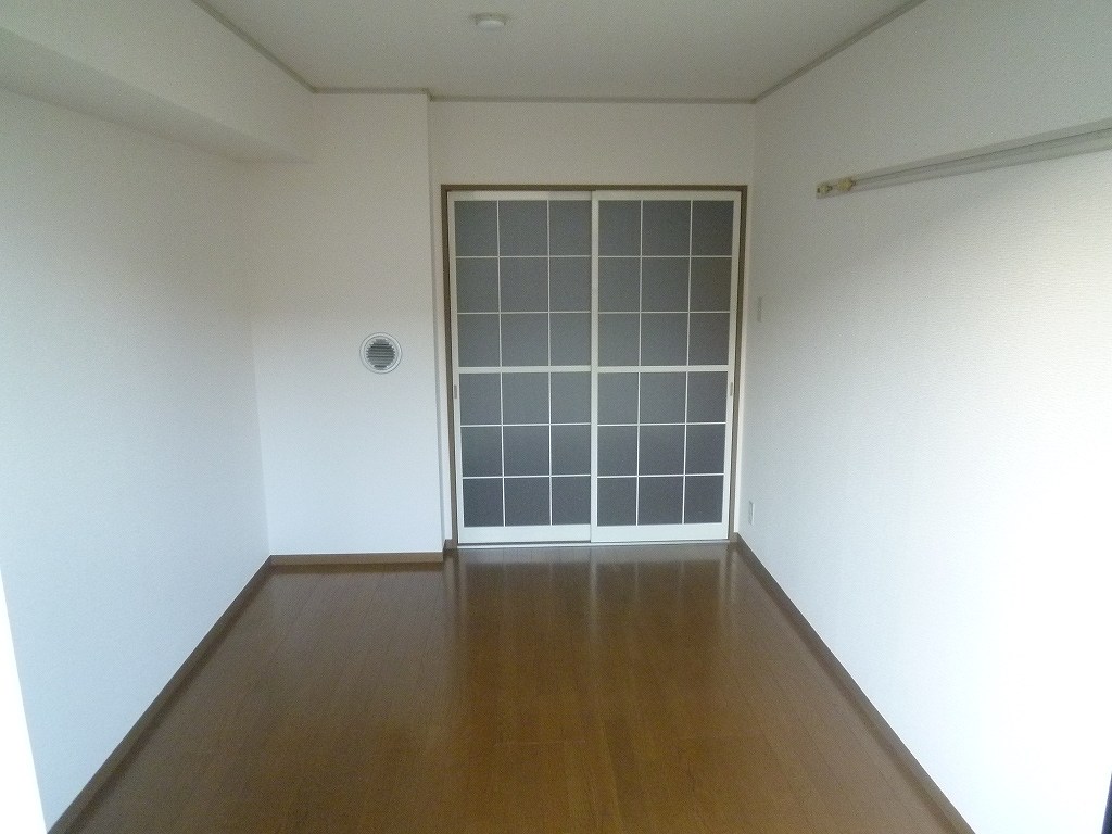 Other room space. It is a photograph of another room of the same properties