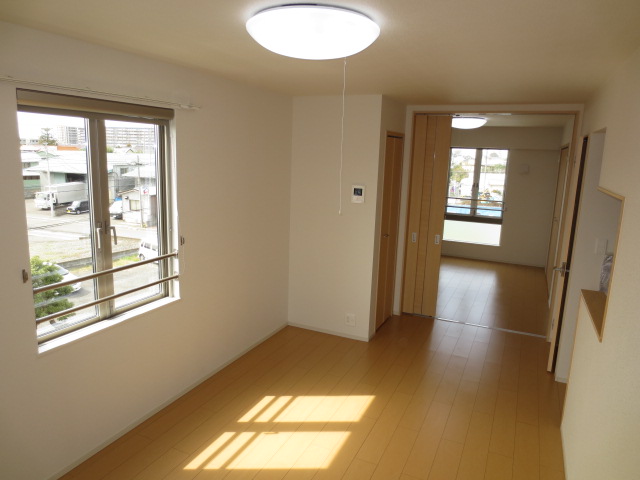 Living and room. It is a photograph of another room