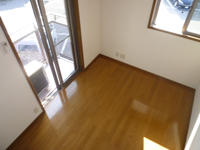 Living and room. It is a photograph of another room