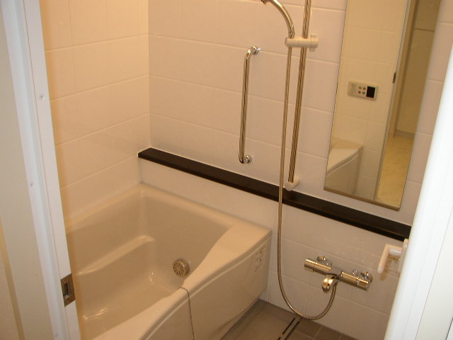 Bath. Same property, It is a photograph of another room