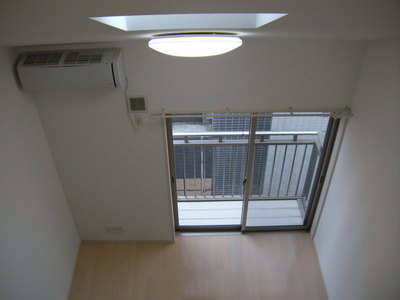 Living and room. Is high ceiling if there is a loft.