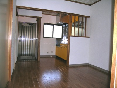 Living and room. Yellow kitchen is accented rooms