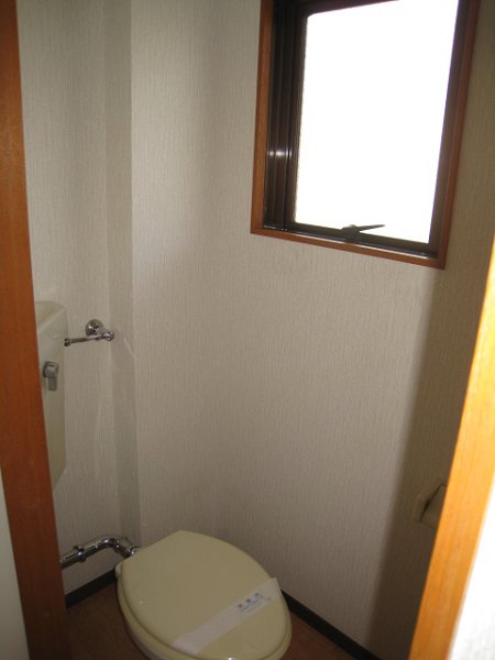 Toilet. There is a window in the toilet