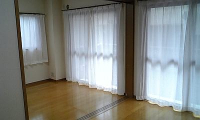 Living and room. It is a photograph of the same type of room. Open and open the sliding door