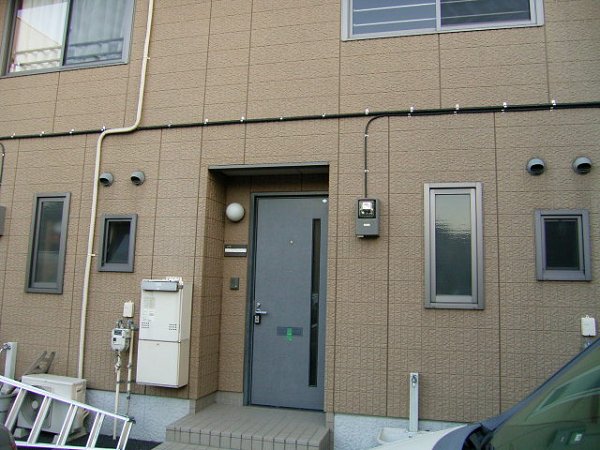 Entrance. There outside faucet to door to door.