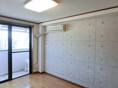 Living and room. One side wallpaper is accented with cross