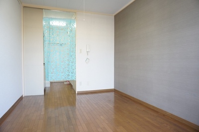 Living and room. One surface wallpaper is accented with cross