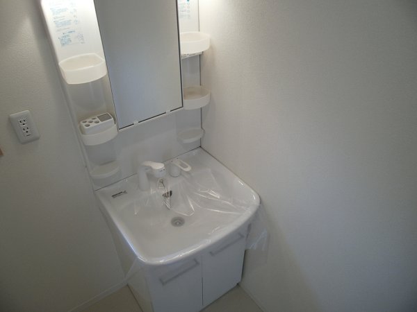 Washroom. Mirror is a photo of the same type.