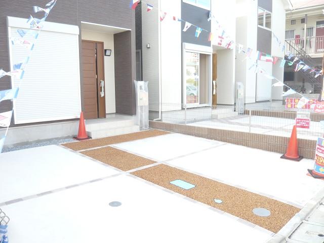 Parking lot. It is a photograph of the front door around and parking. Two happy car space.