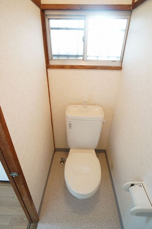 Toilet. Western-style toilet with a window