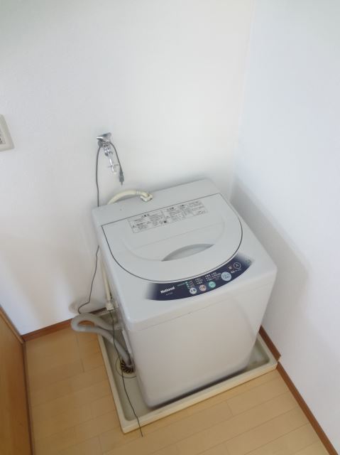 Washroom. It is with in-room washing machine storage!