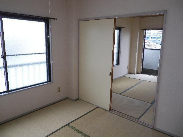 Living and room. Following is a Japanese-style room.