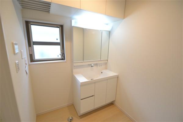 Wash basin, toilet. Large three-sided mirror with a wash basin that housed in the upper part