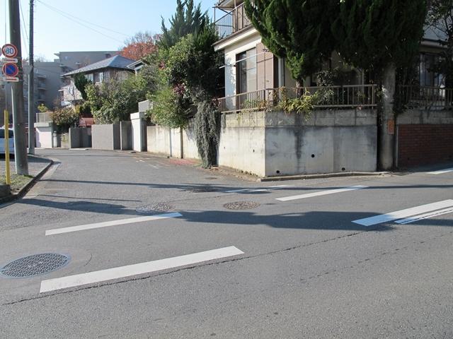 Local photos, including front road. There is a feeling of opening per corner lot