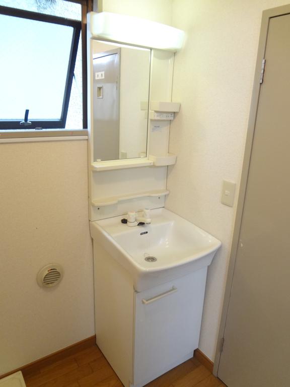 Washroom. With happy independent wash basin in a busy morning