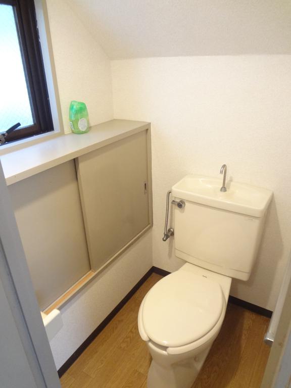 Toilet. Window there restrooms convenient storage rack with