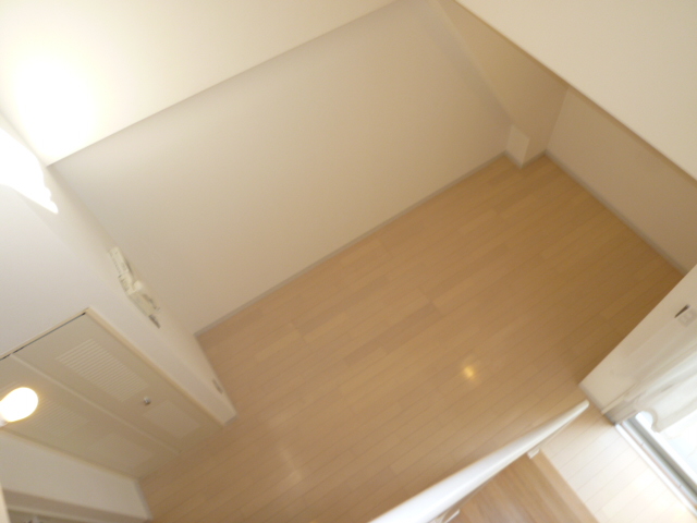 Living and room. It is a photograph of another room