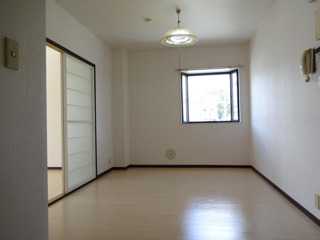 Toilet. It is bright with a living space bay windows