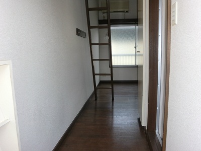 Entrance. It is a photograph of another room. 