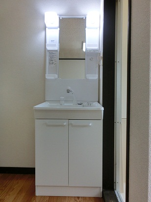 Washroom. It is a photograph of another in Room.