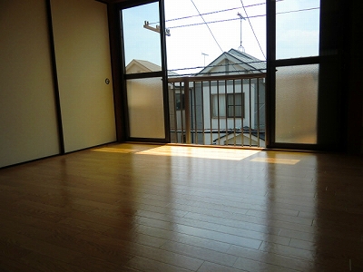 Other room space. It is a photograph of another in Room.