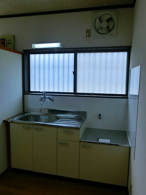 Kitchen. It is a photograph of another in Room.