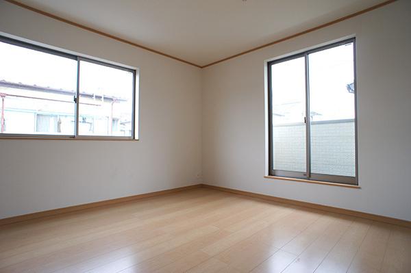 Living. Plenty of sunshine from large windows shine in