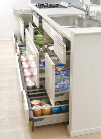 Kitchen.  [Sliding storage] Storage of system kitchens, It can be effectively utilized in the prone cabinet in a dead space, It has adopted a sliding storage.