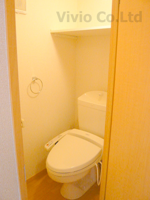 Toilet. It is a warm water washing toilet seat.