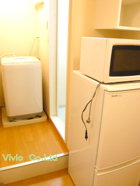 Other room space. Refrigerator & with a microwave.