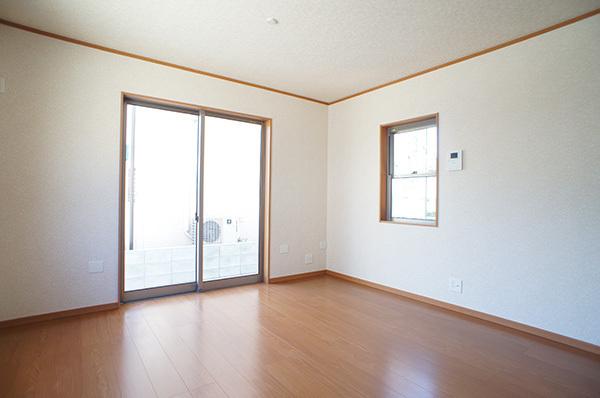 Living. Plenty of sunshine from large windows shine in